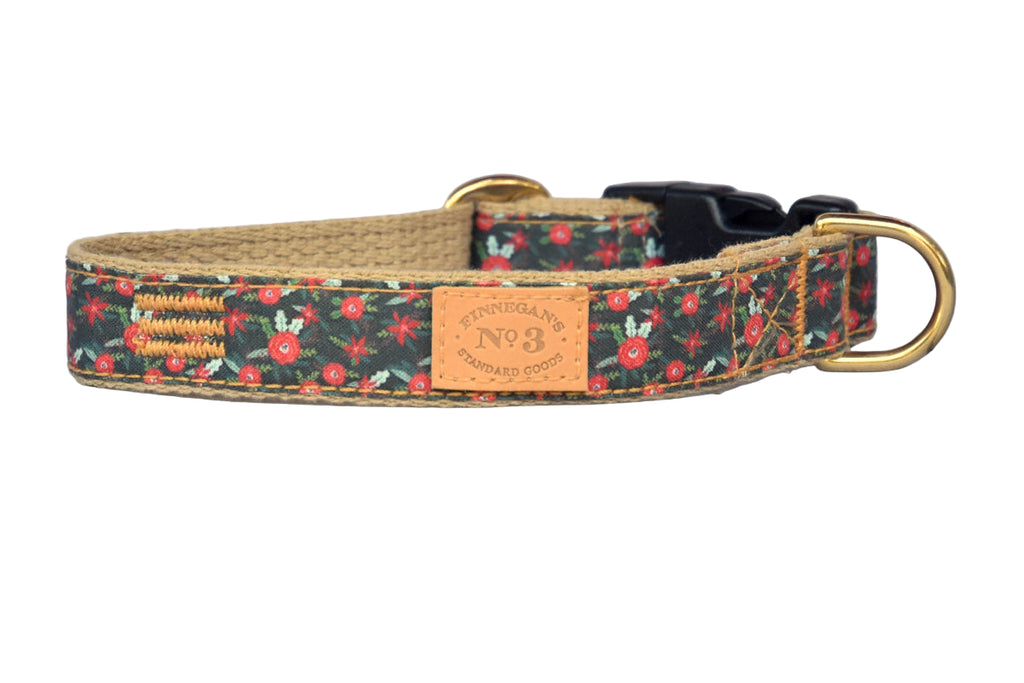Dog collar with floral pattern and leather tag on a gray background