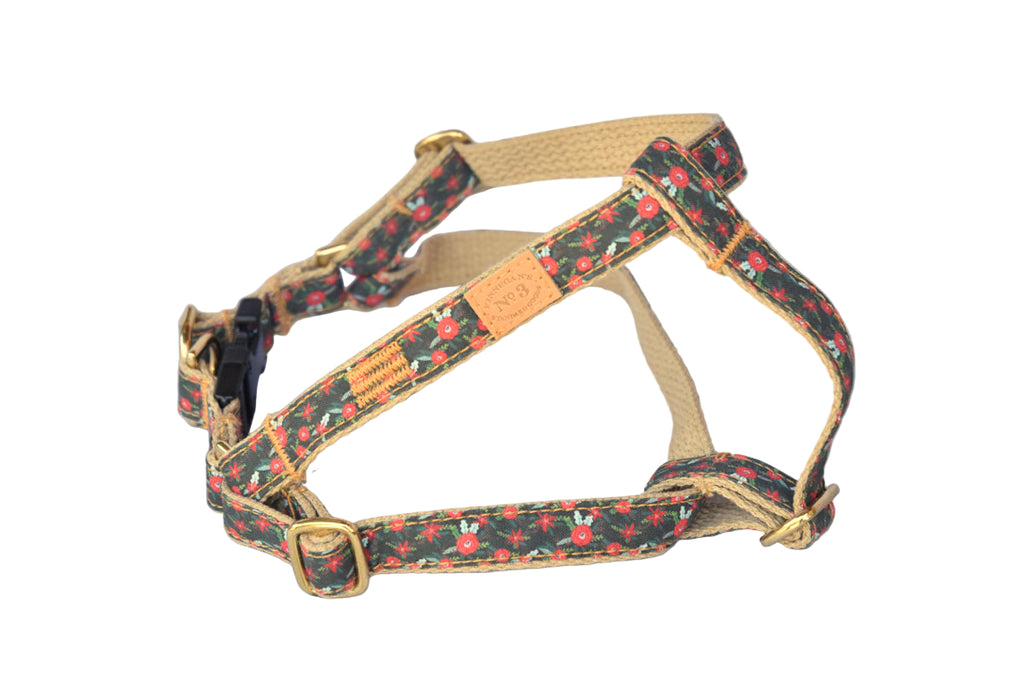 Dog harness with floral pattern on a wooden surface