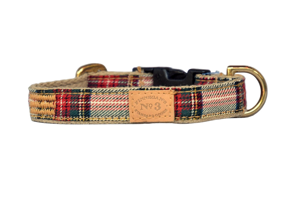 Plaid dog collar with gold buckle on a light gray background